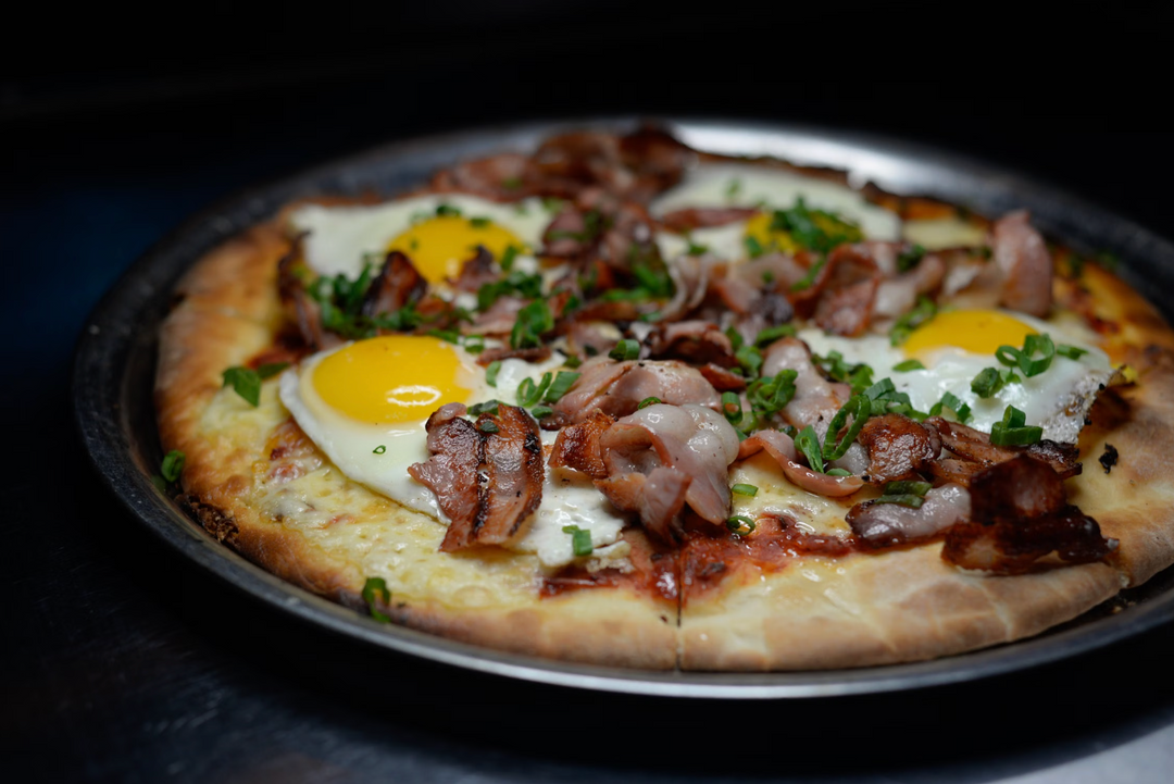 Garden Brunch Pizza with Basil EVOO, Smoked Provolone & Fried Eggs